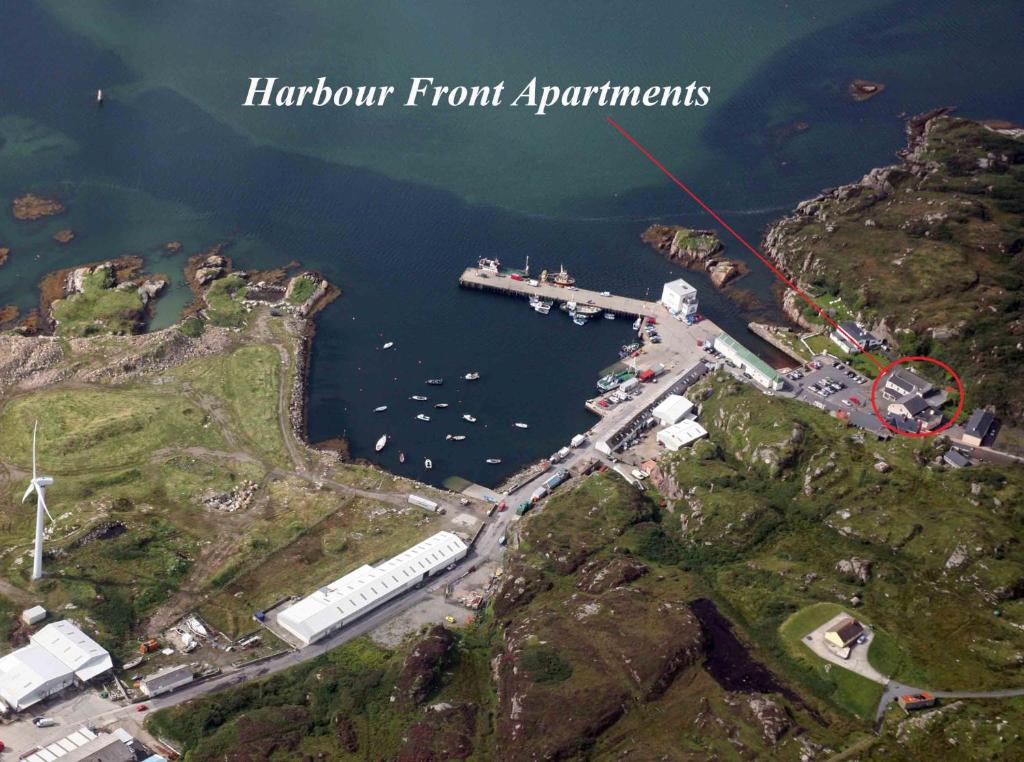an aerial view of a harbor with a boat dock at Harbour front apartments in Burtonport