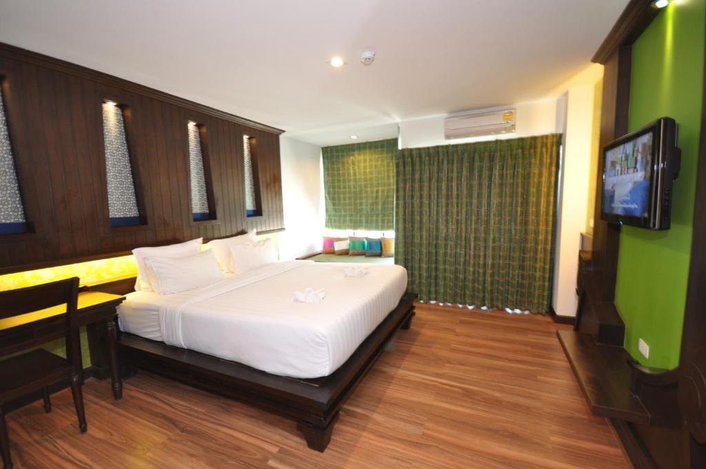 Postel nebo postele na pokoji v ubytování Chalelarn Hotel Hua Hin