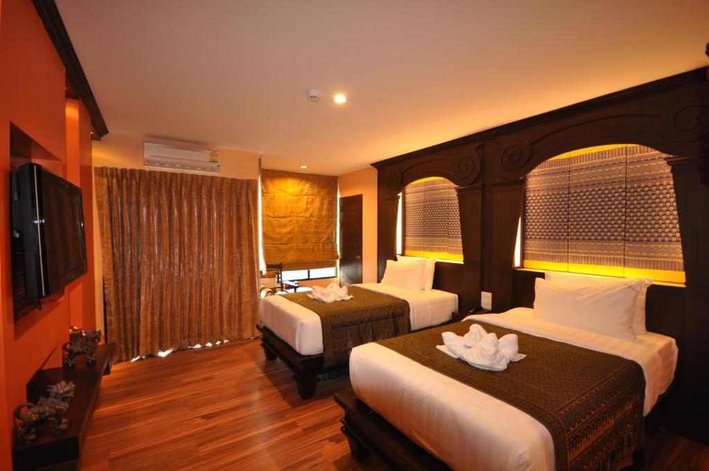 Postel nebo postele na pokoji v ubytování Chalelarn Hotel Hua Hin