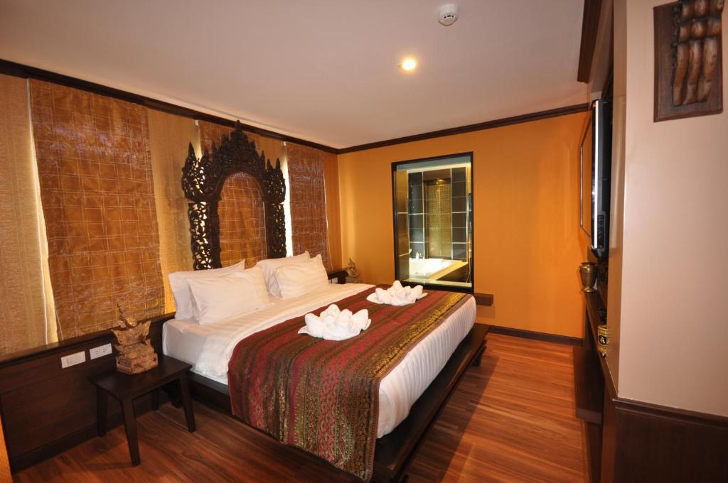 Postel nebo postele na pokoji v ubytování Chalelarn Hotel Hua Hin