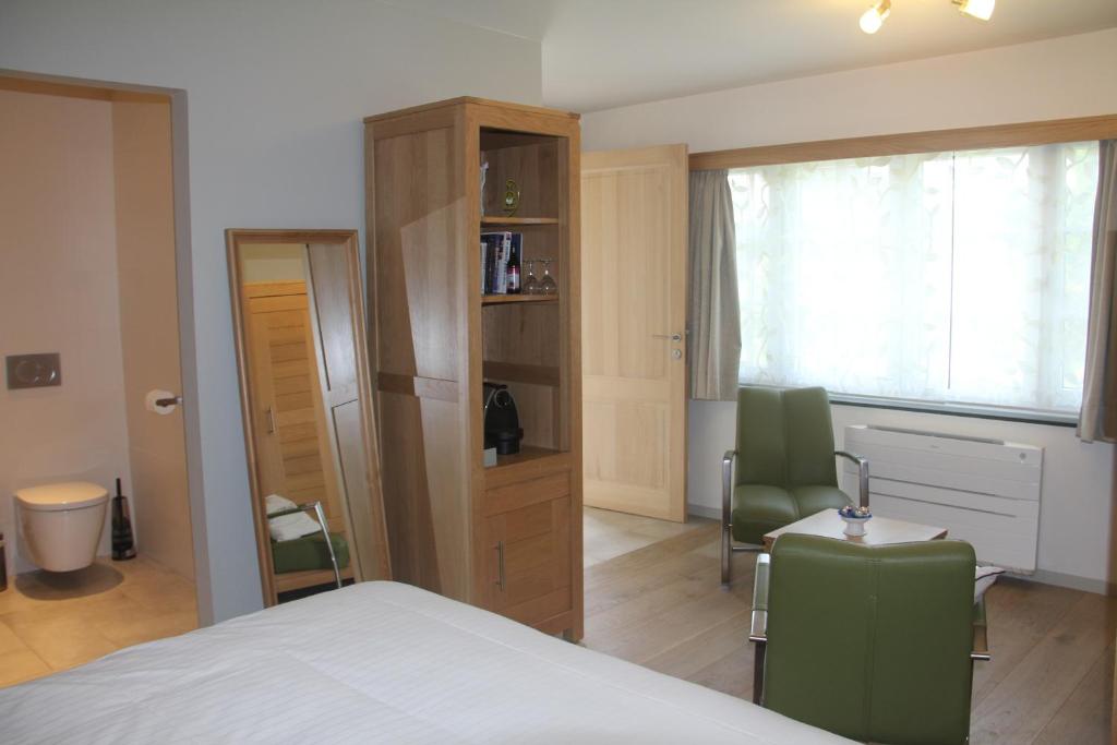 Postel nebo postele na pokoji v ubytování B&B Het KoeKoeKsnest Schelle