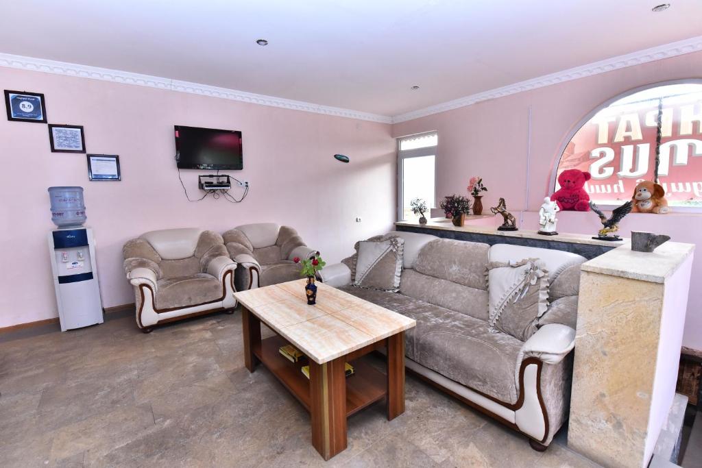 a living room with a couch and a table at Haghpat Hotel in Haghpat