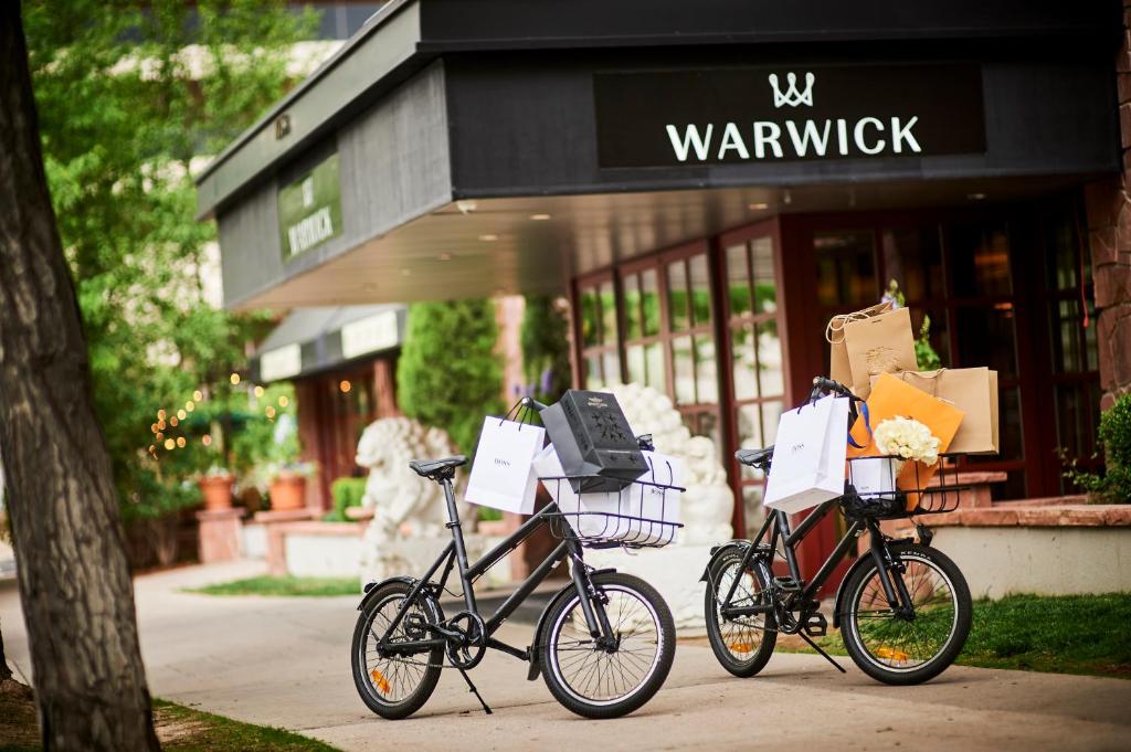 two bikes parked in front of a store at Warwick Denver in Denver