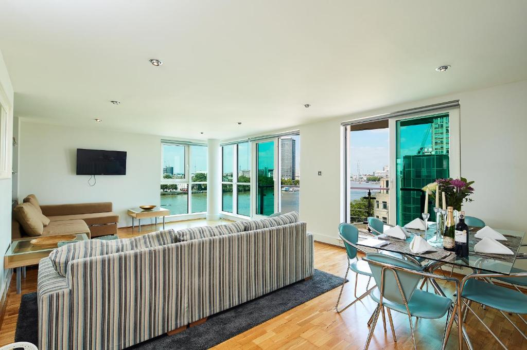 a living room with a couch and a table at Second Nest Thames View in London