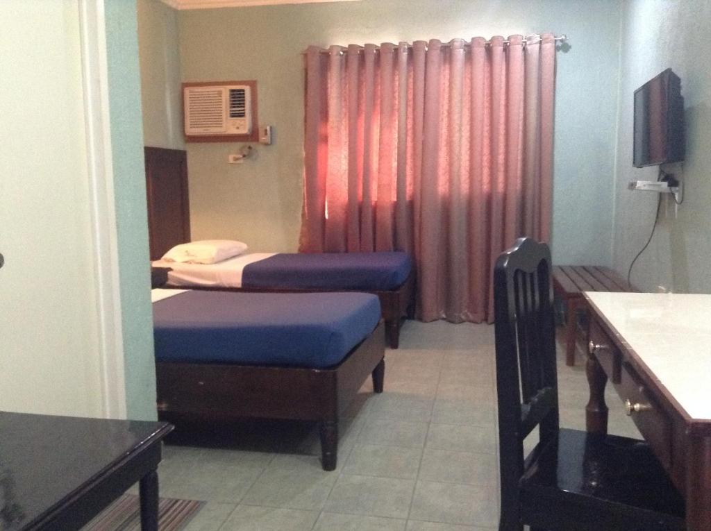 Postel nebo postele na pokoji v ubytování Miami Inn