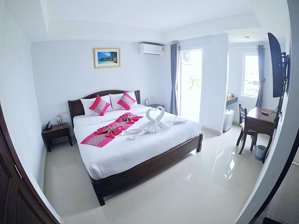 Postel nebo postele na pokoji v ubytování Sunrise Inn