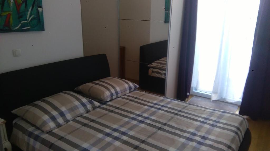 Posteľ alebo postele v izbe v ubytovaní Centar Split Apartments Manuš
