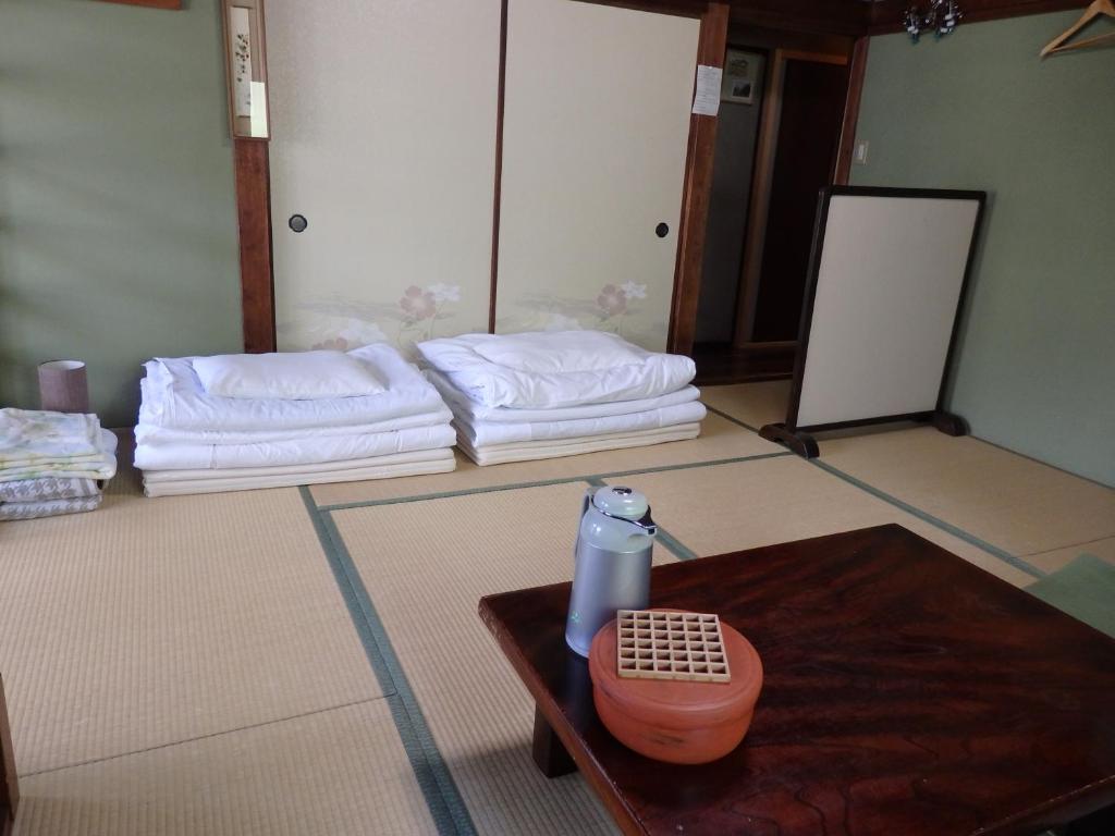 Letto o letti in una camera di Guesthouse Tamura