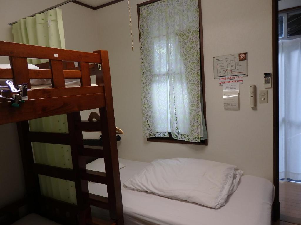 Letto o letti in una camera di Guesthouse Tamura