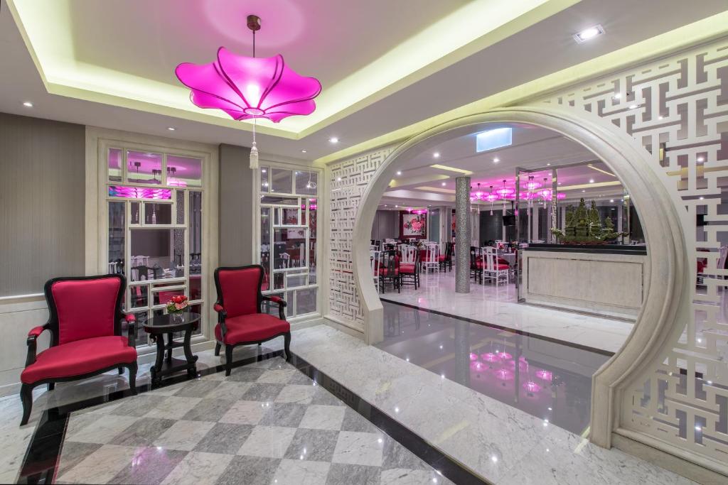 A polished lobby seating area opening onto the hotel restaurant.