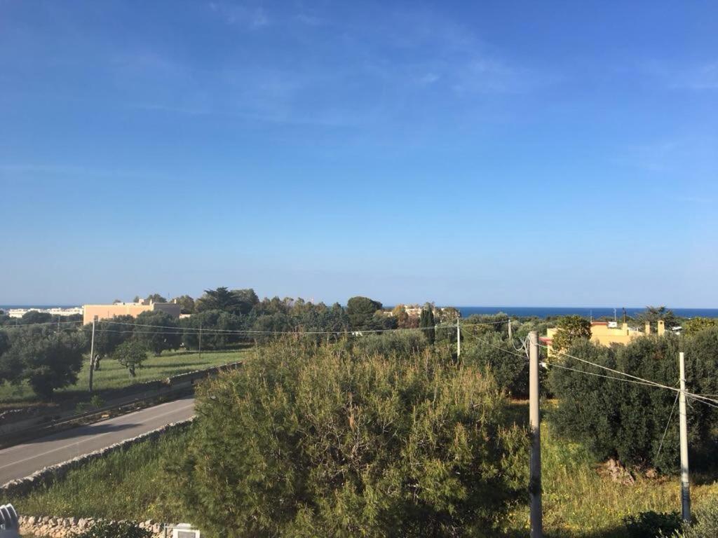 a view of a road with the ocean in the background at Villa Anna in Savelletri di Fasano