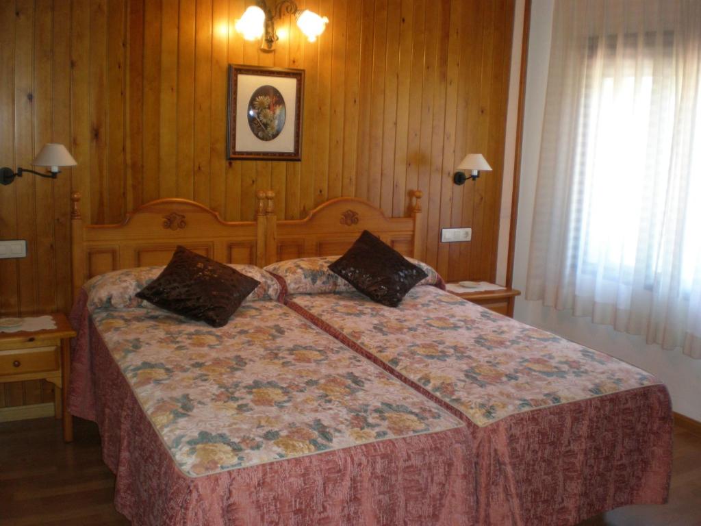 En eller flere senge i et værelse på Hotel Bellavista Ordesa