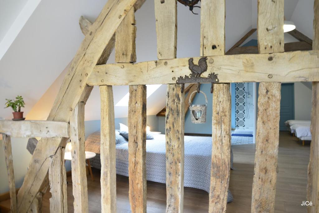 Postel nebo postele na pokoji v ubytování Chambres d'hôtes Ferme du Feugrès