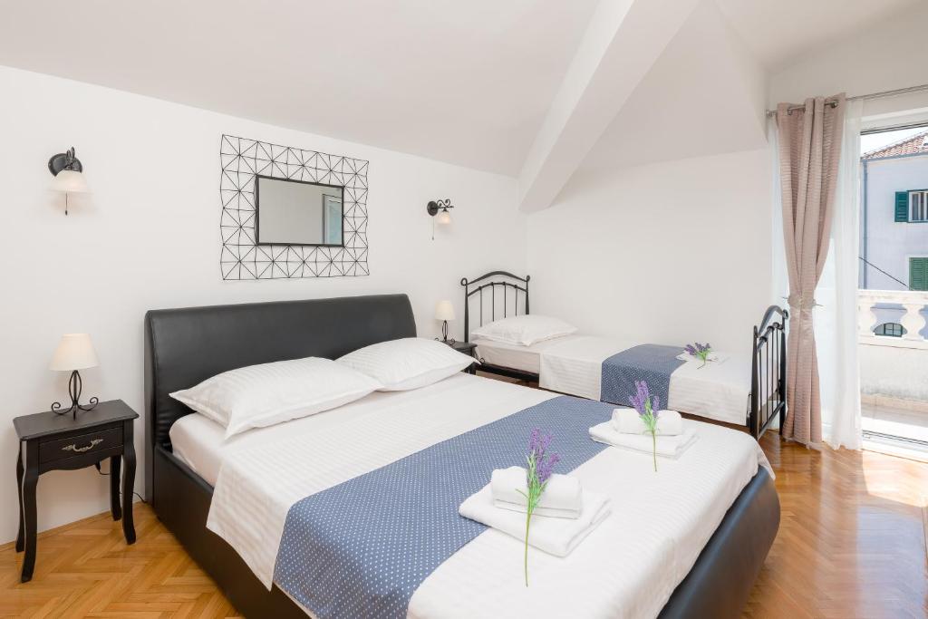 Posteľ alebo postele v izbe v ubytovaní Spalato Dream Apartmants