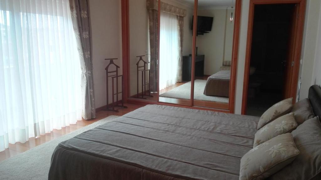 Postel nebo postele na pokoji v ubytování Quarto/Suite de Charme