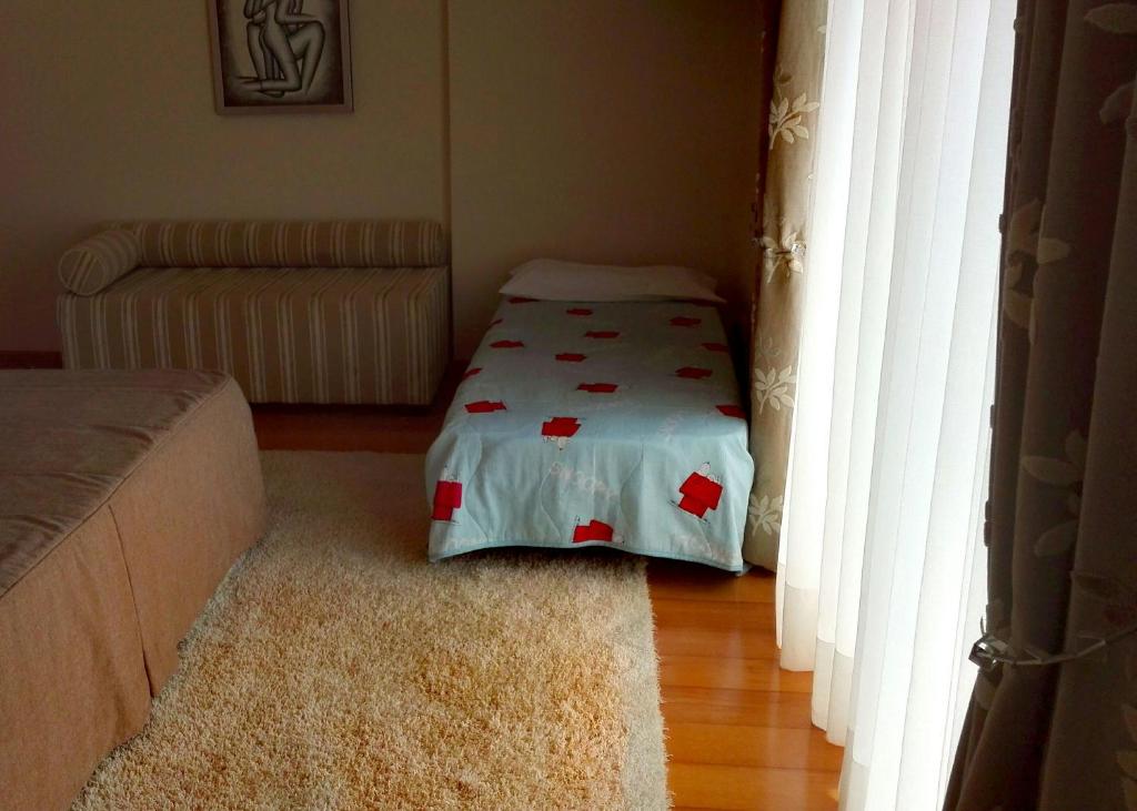 Postel nebo postele na pokoji v ubytování Quarto/Suite de Charme