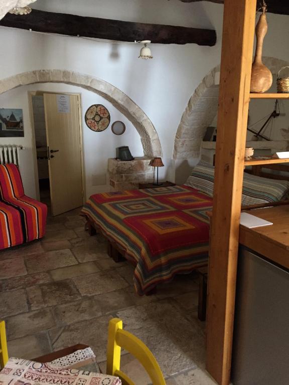 Postel nebo postele na pokoji v ubytování Trulli di Pozzomasiello
