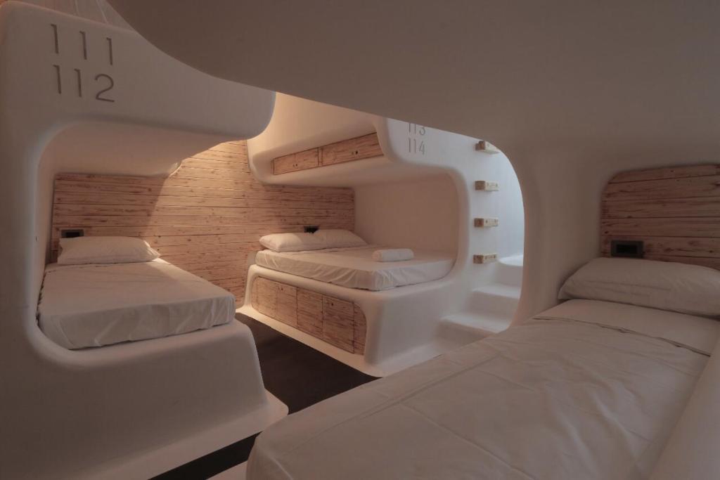Postel nebo postele na pokoji v ubytování MyCocoon Hostel