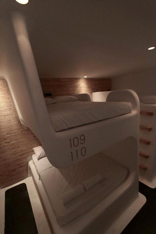 Postel nebo postele na pokoji v ubytování MyCocoon Hostel