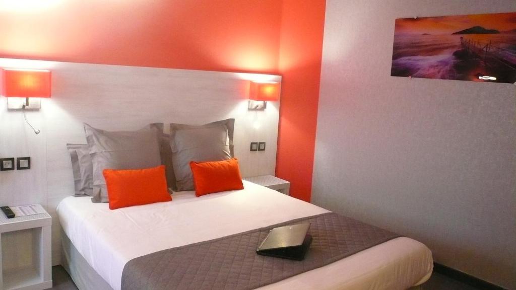 Postel nebo postele na pokoji v ubytování Hôtel L'Européen