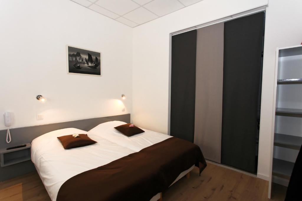 Postel nebo postele na pokoji v ubytování Hôtel De L'Ill