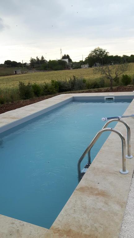 The swimming pool at or close to Trulli Spinosa