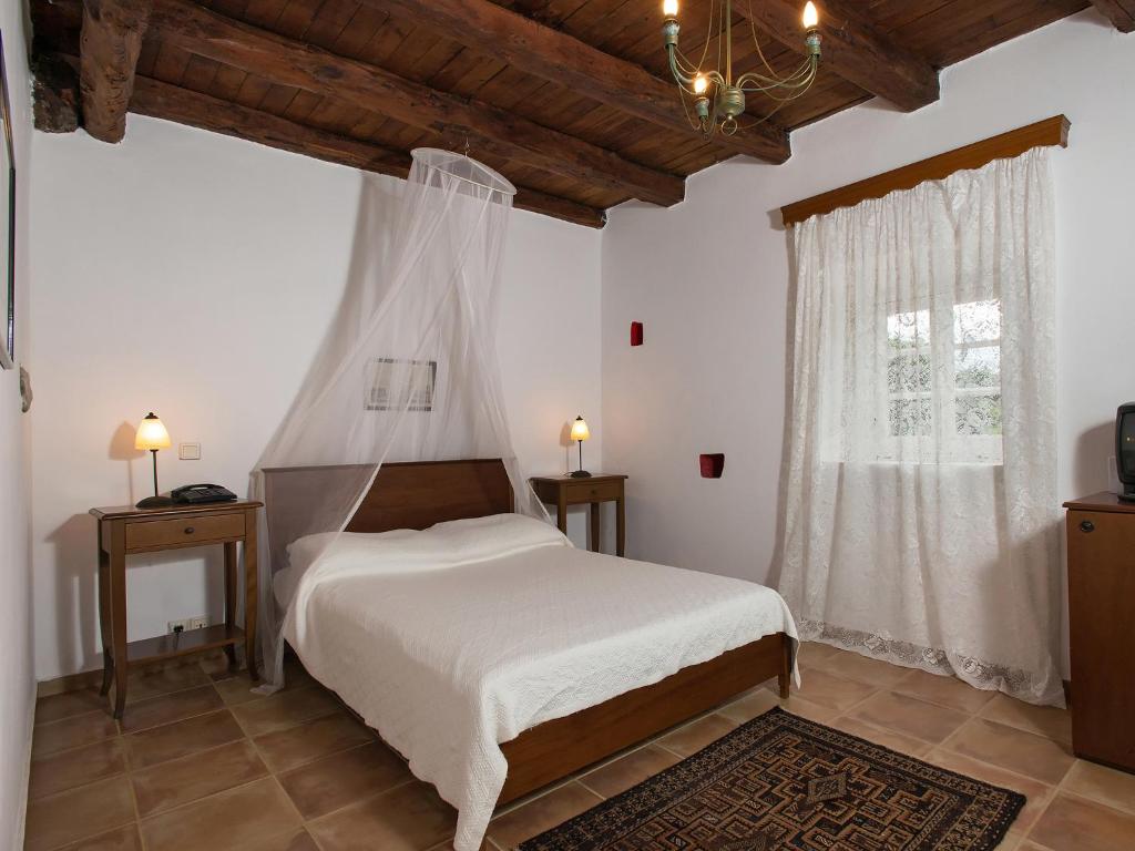 Postel nebo postele na pokoji v ubytování Villa De Loulia