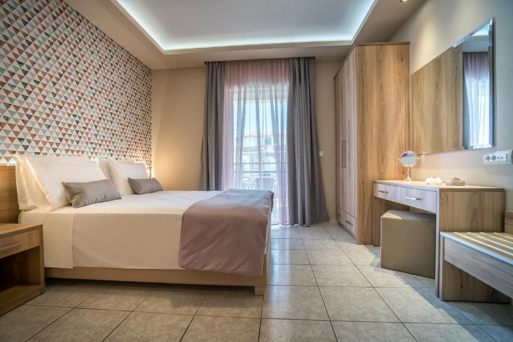 Postel nebo postele na pokoji v ubytování Mavrias Village