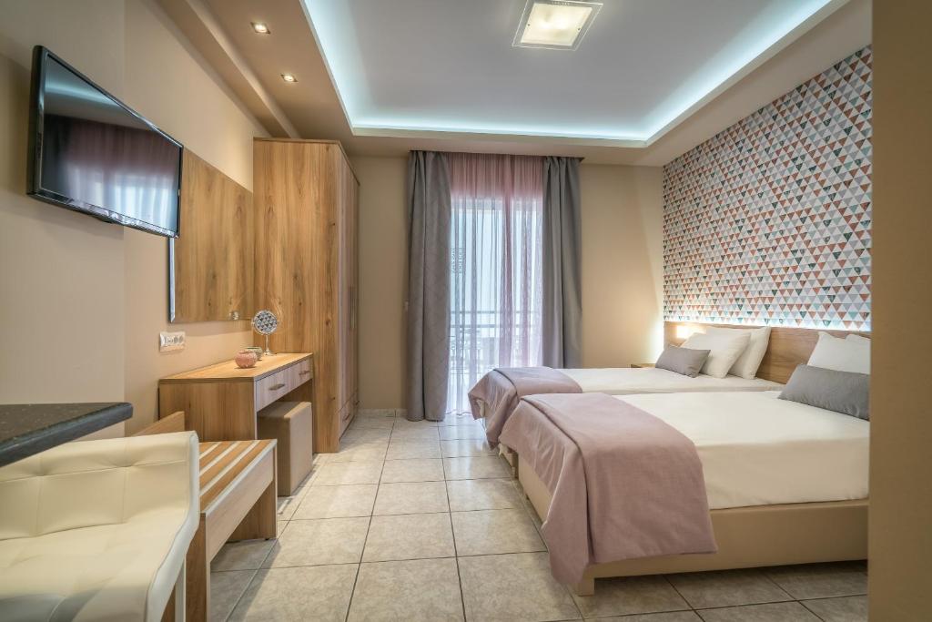 Postel nebo postele na pokoji v ubytování Mavrias Village