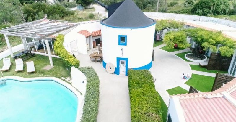 an aerial view of a house with a swimming pool at O Moinho da Roca in Azoia