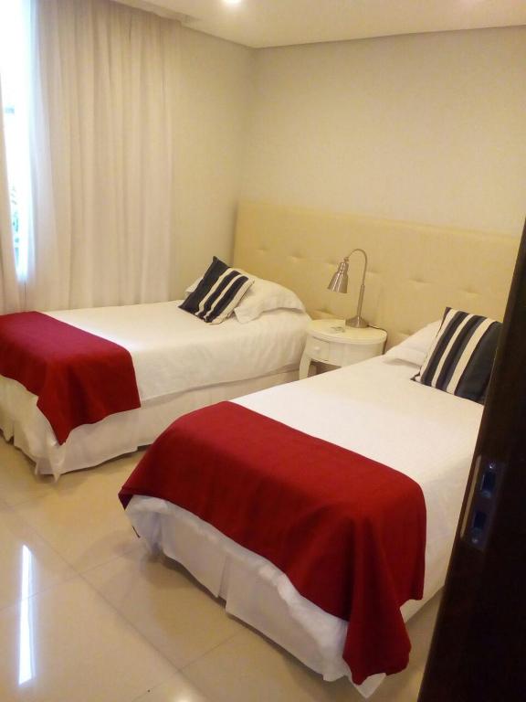 Postel nebo postele na pokoji v ubytování Departamento moderno en Asunción Villa Morra
