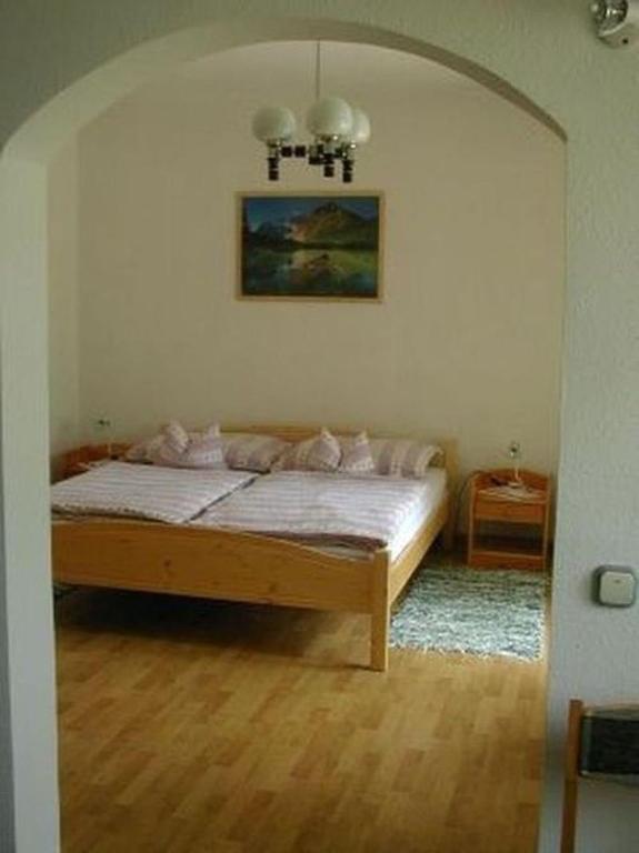 Posteľ alebo postele v izbe v ubytovaní Apartman Németh