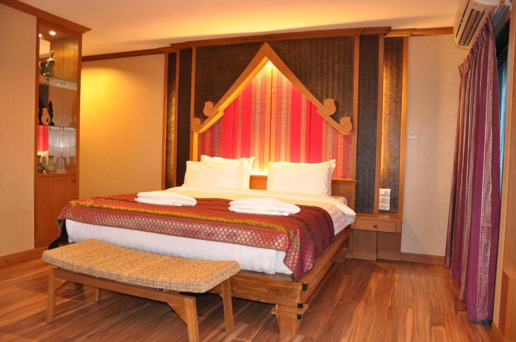 Postel nebo postele na pokoji v ubytování Chalelarn Hotel Hua Hin