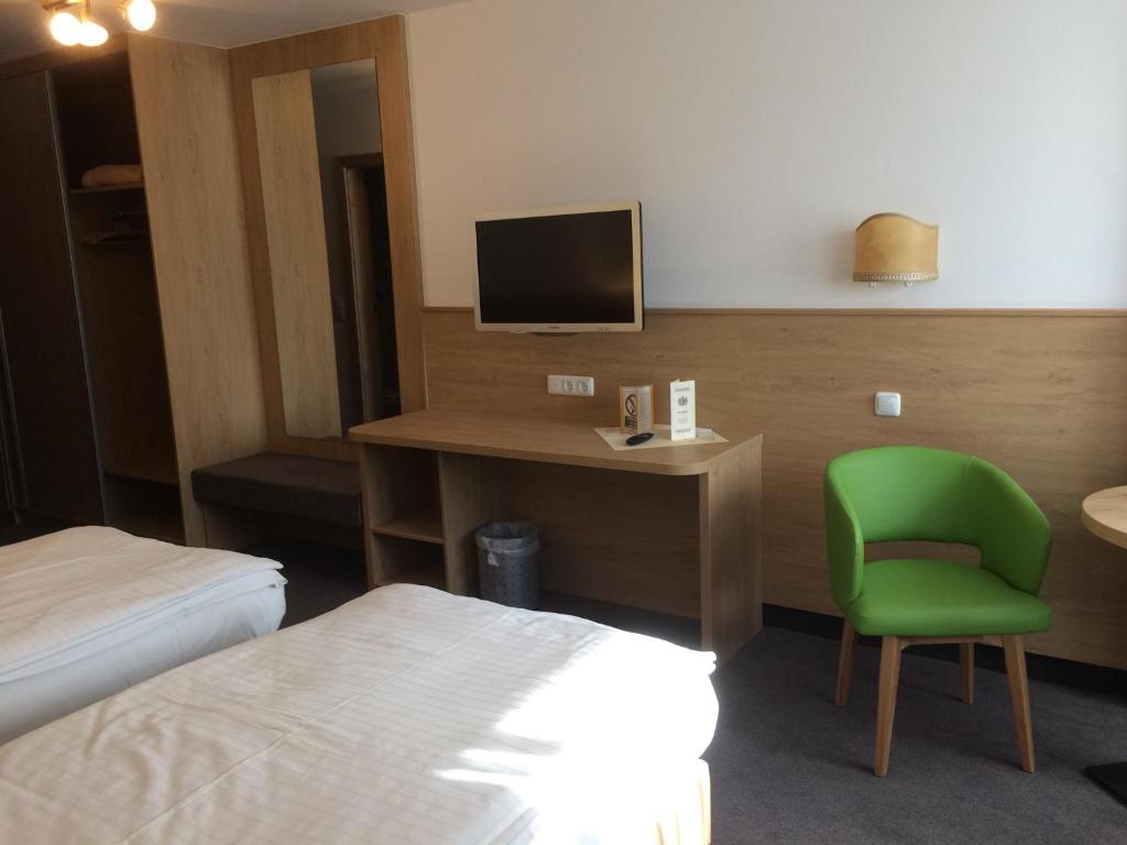 Postel nebo postele na pokoji v ubytování Isar Hotel