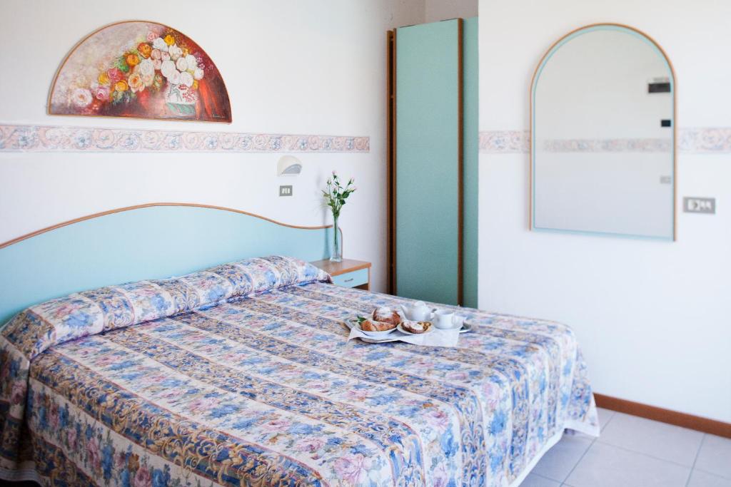 Postel nebo postele na pokoji v ubytování Hotel Villa Gori