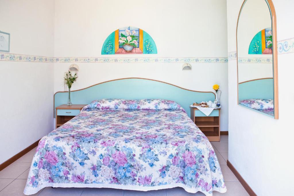Postel nebo postele na pokoji v ubytování Hotel Villa Gori