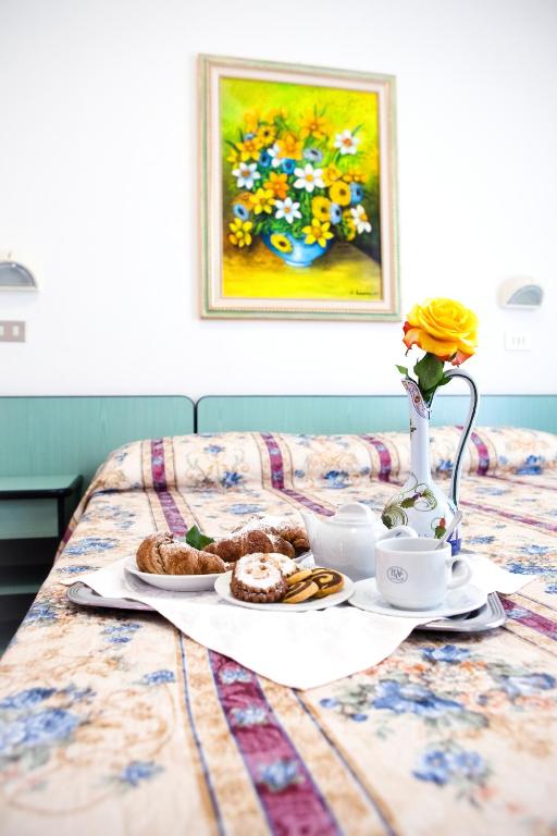 Postel nebo postele na pokoji v ubytování Hotel Villa Gori