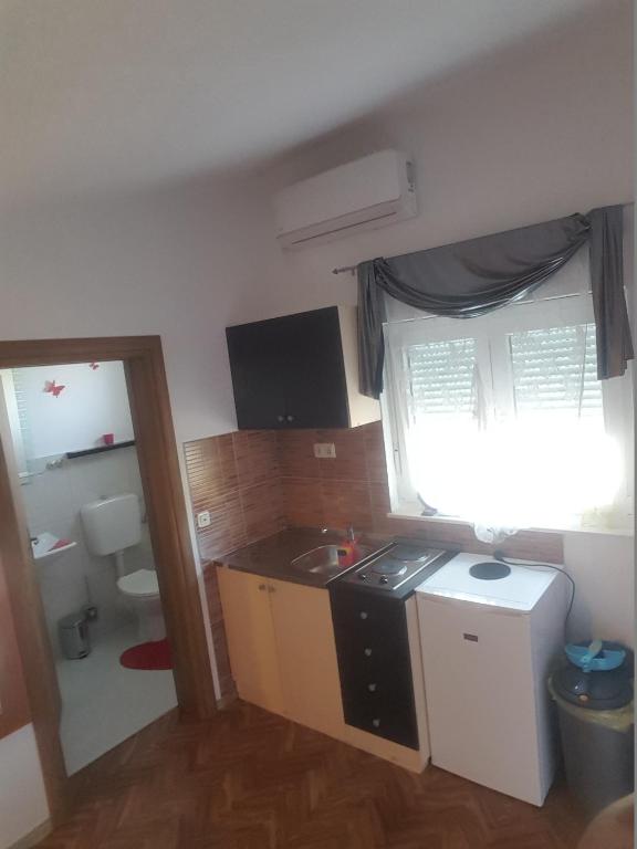 Kuchyňa alebo kuchynka v ubytovaní Apartments Megi