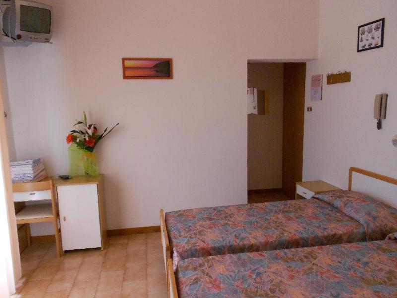 Postel nebo postele na pokoji v ubytování Hotel Vevey