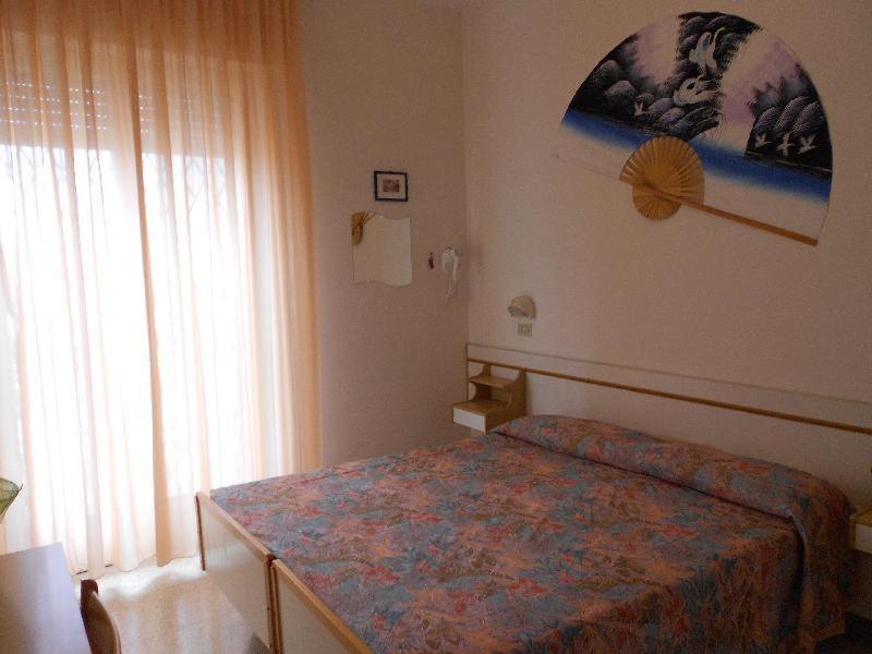 Postel nebo postele na pokoji v ubytování Hotel Vevey
