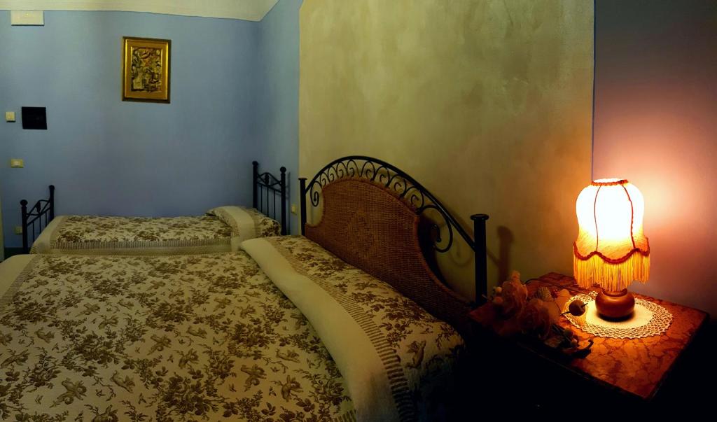 Postel nebo postele na pokoji v ubytování B&B Casale Ginette