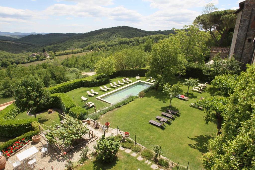 an aerial view of a garden with a swimming pool at Hotel Palazzo Squarcialupi in Castellina in Chianti