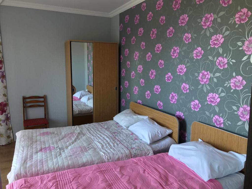 Llit o llits en una habitació de Kvariati - Guest House