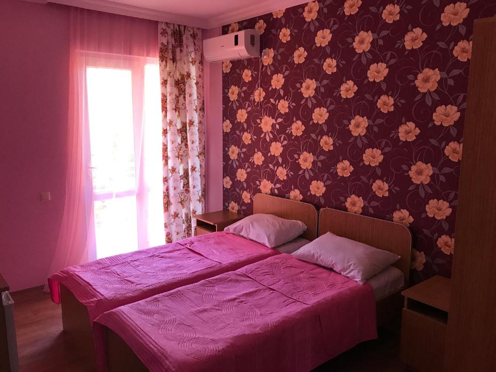 Llit o llits en una habitació de Kvariati - Guest House