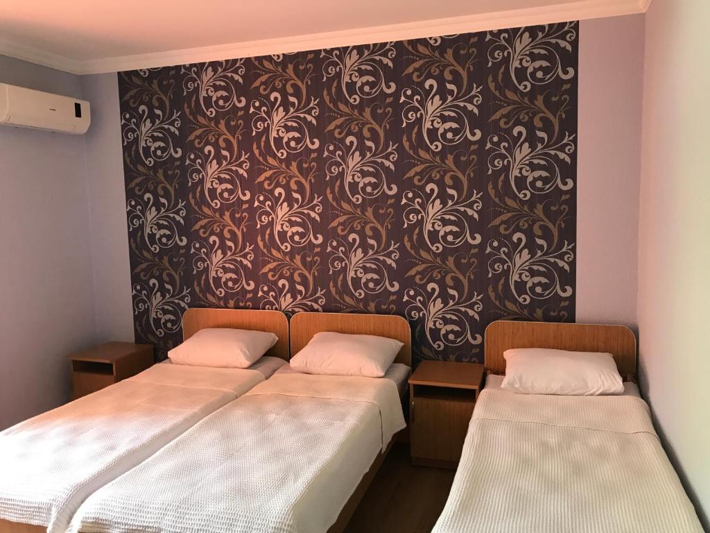 Llit o llits en una habitació de Kvariati - Guest House