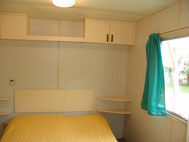 Postel nebo postele na pokoji v ubytování Camping Ribera del Ara