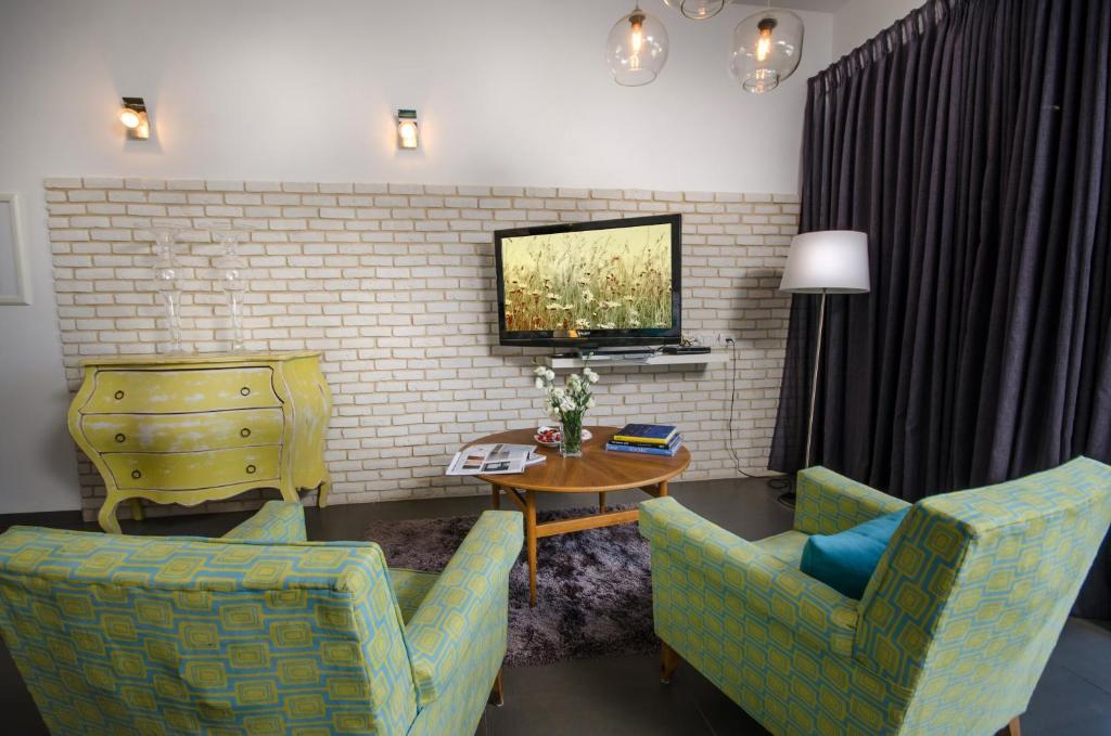 TV a/nebo společenská místnost v ubytování The Fifties suites