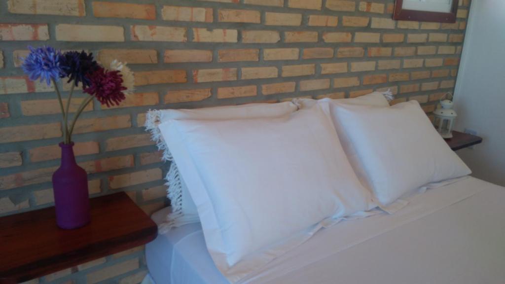 Postel nebo postele na pokoji v ubytování Vila Beija-flor