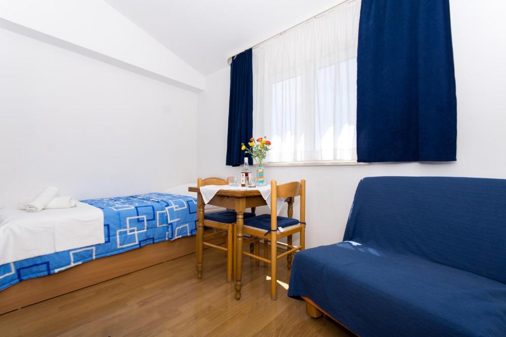 Posteľ alebo postele v izbe v ubytovaní Marko Apartments