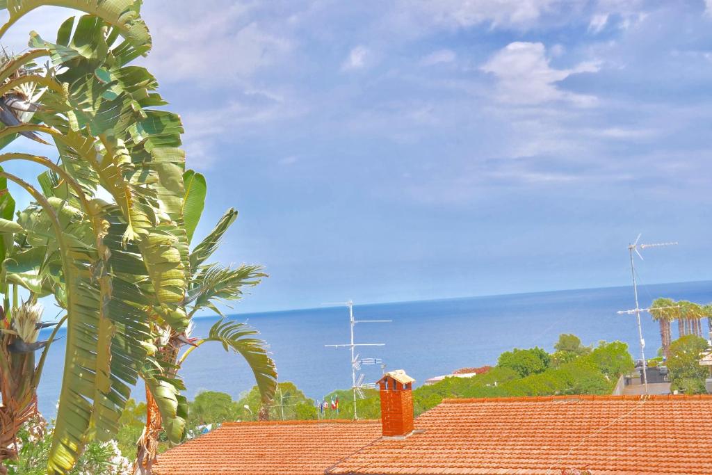 a view of the ocean from the roof of a house at Villa Alba in Acitrezza